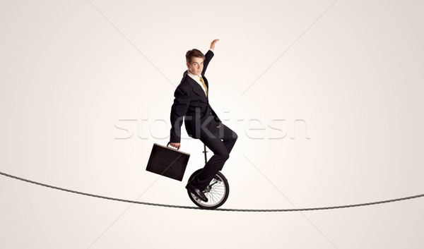 Extreme деловой человек верховая езда одноколесном велосипеде веревку человека Сток-фото © ra2studio