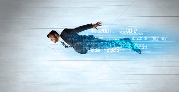 Businessman flying super fast with data numbers left behind Stock photo © ra2studio