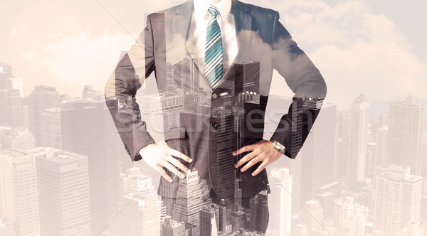 Handsome business man with overlay cityscape Stock photo © ra2studio