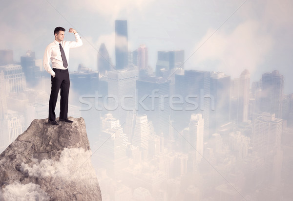 Winner urban businessman on top of stone  Stock photo © ra2studio