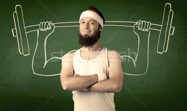Stock photo: Young man lifting weight