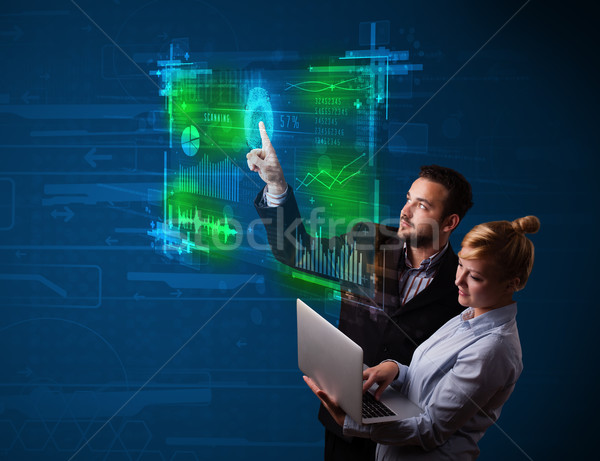 Young business couple pressing modern technology panel with fing Stock photo © ra2studio