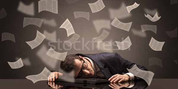 Businessman fell asleep at the office with paperwork concept Stock photo © ra2studio