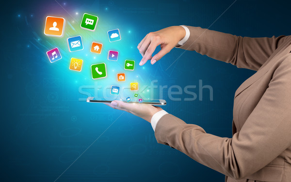 Alkalmazás ikonok tabletta kéz tart zuhan Stock fotó © ra2studio