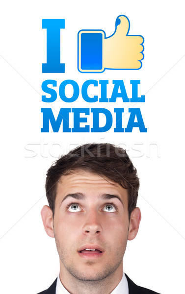 Young head looking at social type of icons and signs Stock photo © ra2studio