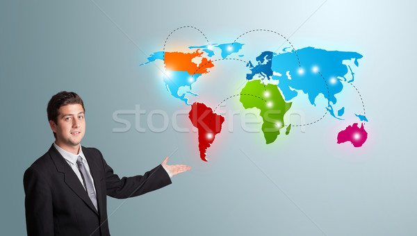 young man presenting colorful world map Stock photo © ra2studio