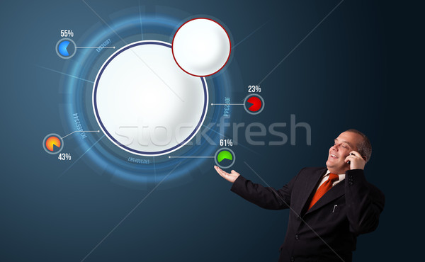Businessman in suit making phone call and presenting abstract modern pie chart Stock photo © ra2studio