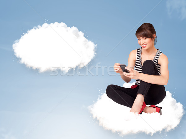 Stock photo: Pretty young girl sitting on cloud and thinking of abstract speech bubble