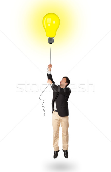 Heureux homme ampoule ballon jeune homme [[stock_photo]] © ra2studio