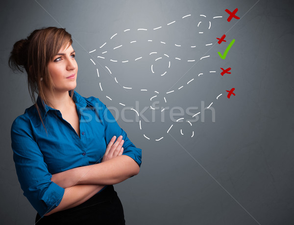 Stock photo: Young woman choosing between right and wrong signs