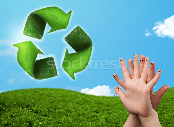 Happy smiley fingers looking at green leaf recycle sign Stock photo © ra2studio