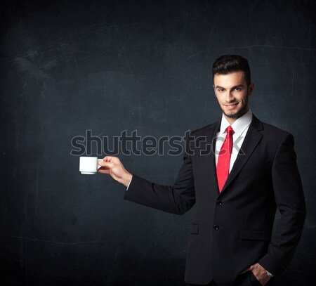 Businessman holding a white cup Stock photo © ra2studio