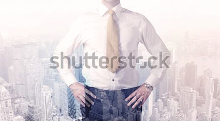 Homme d'affaires permanent ville affaires homme [[stock_photo]] © ra2studio