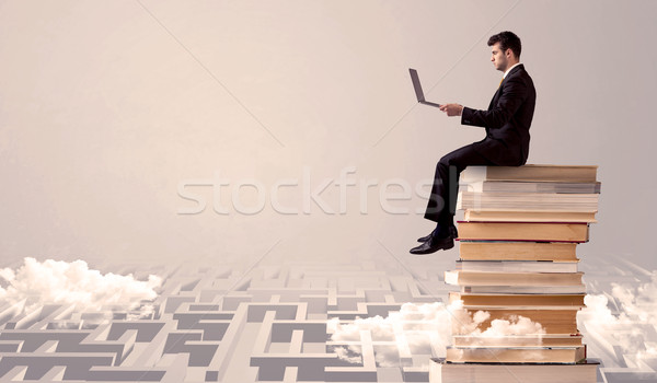 Homme comprimé séance livres affaires portable [[stock_photo]] © ra2studio