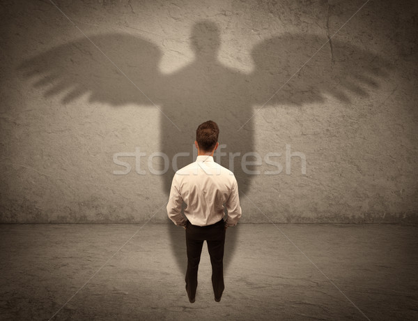 Eerlijk verkoper engel schaduw geslaagd zakenman Stockfoto © ra2studio