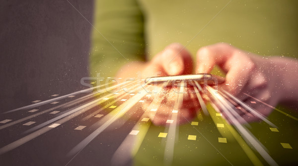 Person holding smarthphone with technology light applications Stock photo © ra2studio