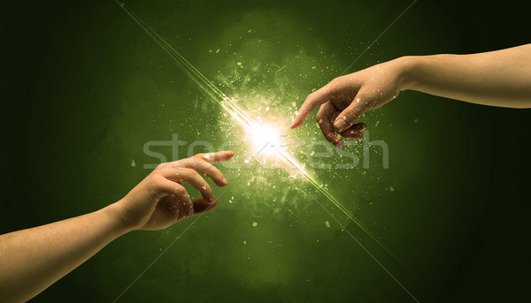 Atingere arme iluminat scanteie varf degetului doua Imagine de stoc © ra2studio