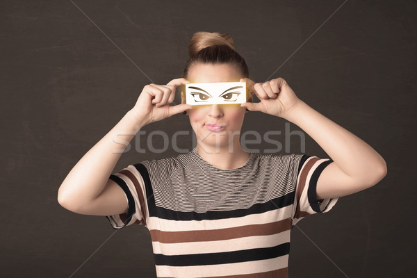 Cool youngster looking with a paper hand drawn eyes Stock photo © ra2studio