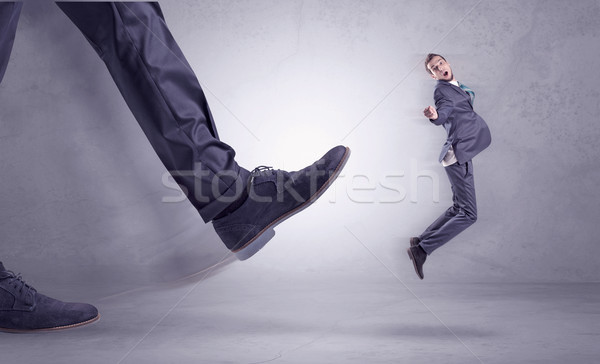 Foot kicking, businessman flying Stock photo © ra2studio