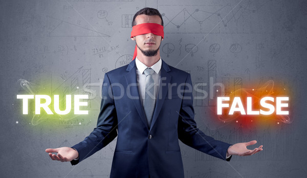 Man with ribbon on his eye making decision Stock photo © ra2studio