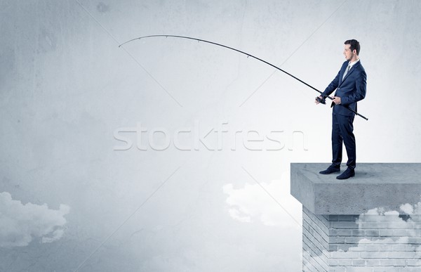 Businessman fishing nothing from the top Stock photo © ra2studio