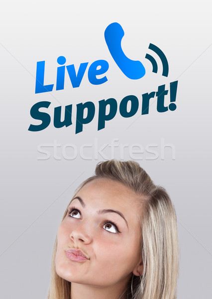 Young girl looking at support contact type of icons and signs Stock photo © ra2studio