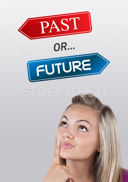 Young girl looking at positive negative signs Stock photo © ra2studio