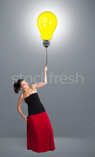 Joli dame ampoule ballon jeune femme [[stock_photo]] © ra2studio