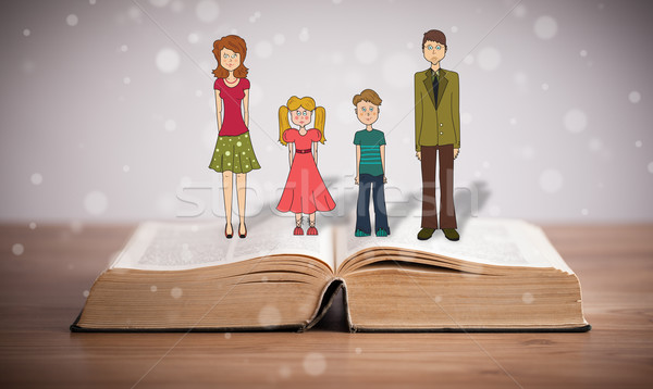 Drawing of a happy family on opened book Stock photo © ra2studio