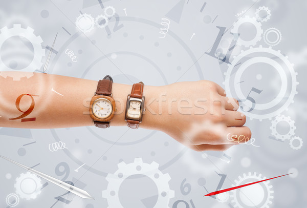 Hand with watch and numbers on the side comming out Stock photo © ra2studio