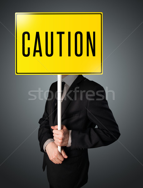 Stock foto: Geschäftsmann · halten · Vorsicht · Zeichen · stehen · gelb
