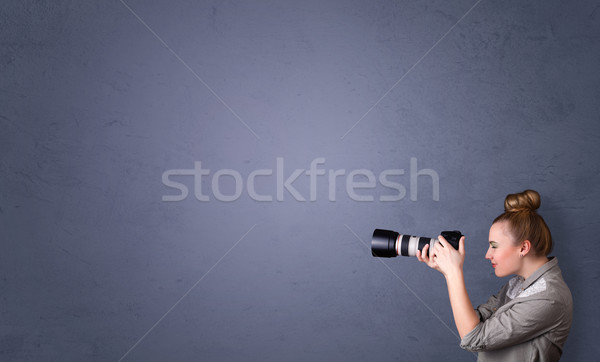 Photographer shooting images with copyspace area Stock photo © ra2studio