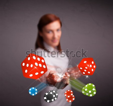 Young woman throwing dices and chips Stock photo © ra2studio