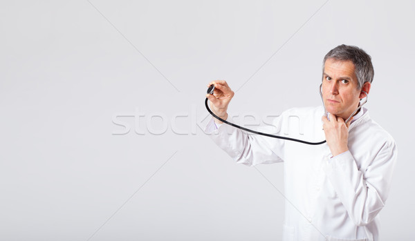 Doctor listening to empty copy space with stethoscope Stock photo © ra2studio