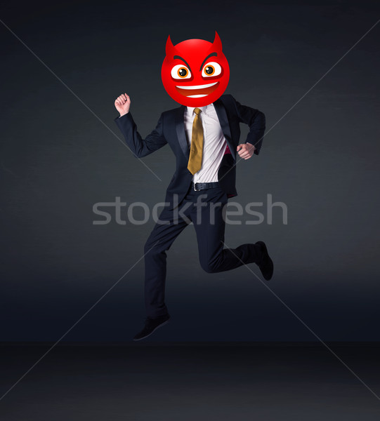 businessman wears devil smiley face Stock photo © ra2studio