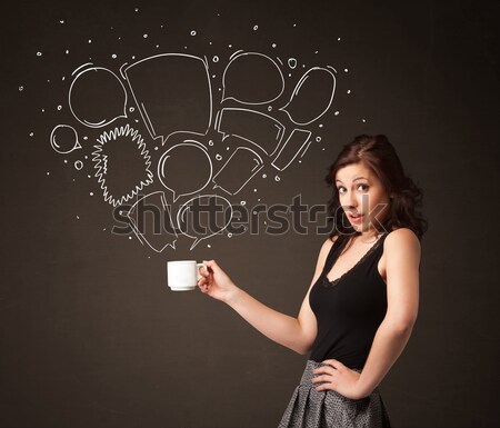 Businesswoman holding a white cup with speech bubbles Stock photo © ra2studio
