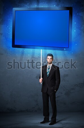 Businessman with shining tablet Stock photo © ra2studio