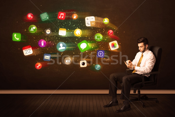 Homme d'affaires séance chaise de bureau comprimé coloré app [[stock_photo]] © ra2studio