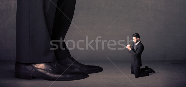 Enorme pernas pequeno empresário em pé Foto stock © ra2studio