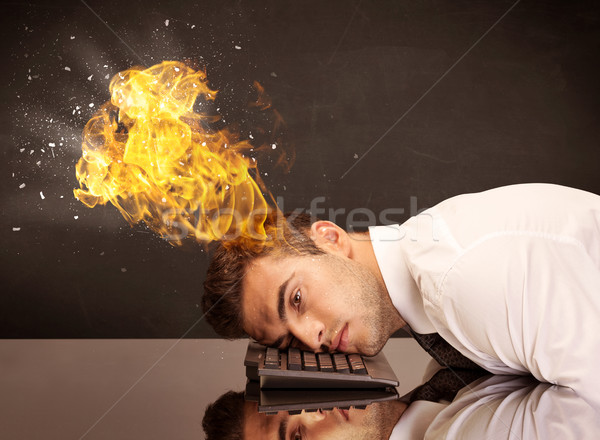 Stressed business man's head is burning Stock photo © ra2studio