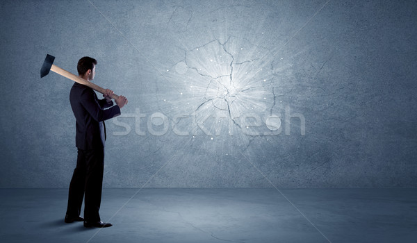 Business man hitting wall with a hammer Stock photo © ra2studio