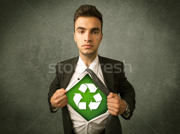 Enviromentalist business man tearing off shirt with recycle sign Stock photo © ra2studio