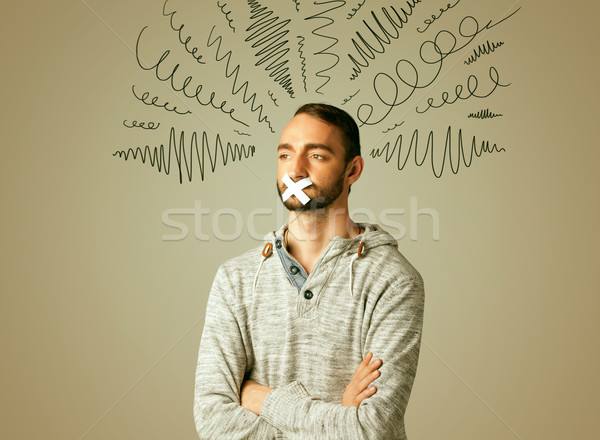 Young man with glued mouth and curly lines Stock photo © ra2studio