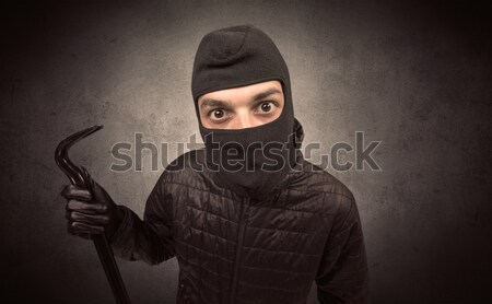Armed villain in an empty dark room Stock photo © ra2studio