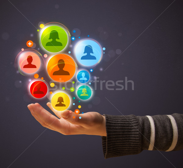 Social network icons in the hand of a woman Stock photo © ra2studio
