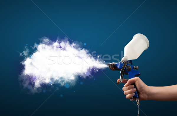 Painter with airbrush gun and white magical smoke  Stock photo © ra2studio