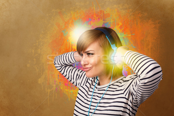 Young woman with headphones listening to music Stock photo © ra2studio