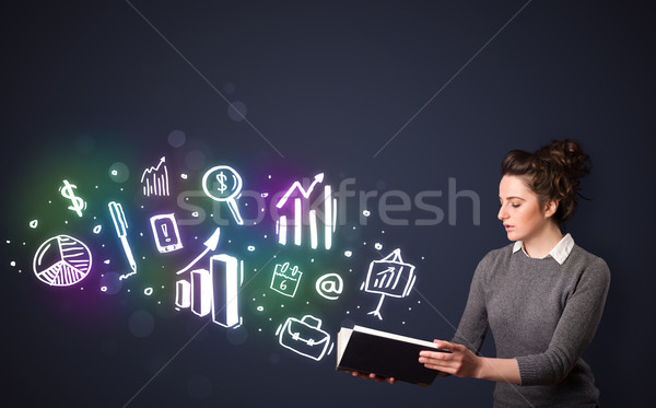 Young lady reading a book with business icons Stock photo © ra2studio