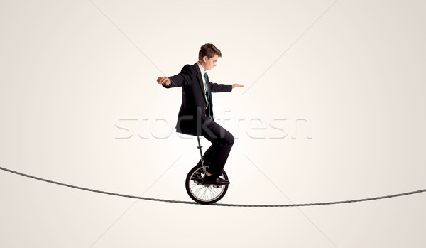 Extreme zakenman paardrijden touw man Stockfoto © ra2studio