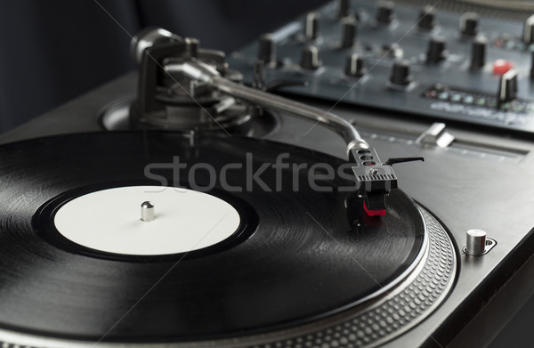 Turntable playing vinyl close up with needle on the record  Stock photo © ra2studio
